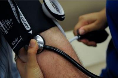 Image of person getting their blood pressure checked.