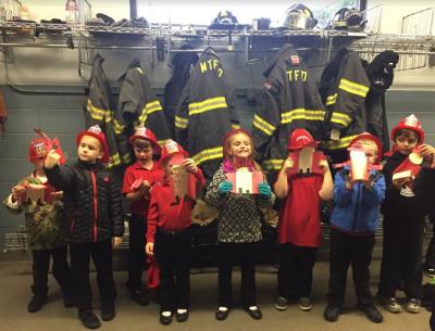 Kindergarten students tour the stations.