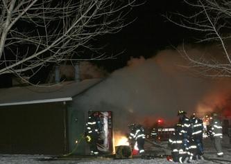 a group of firemen fighting fires at night